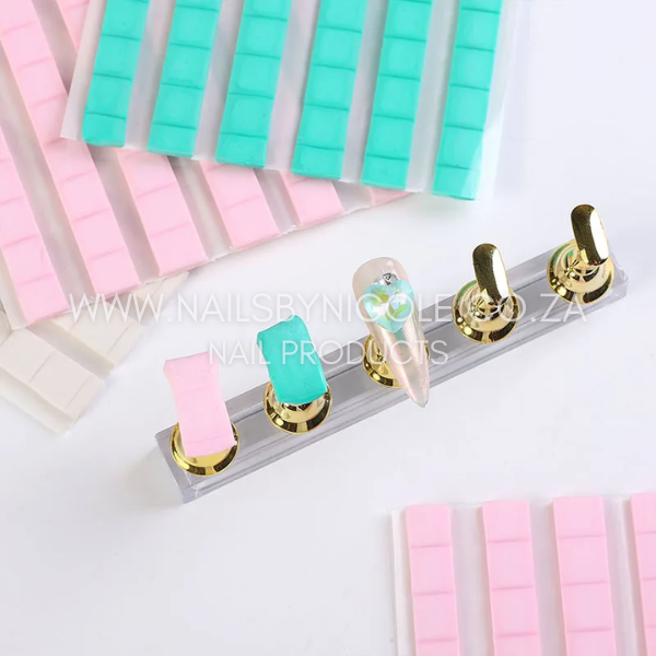Tack-It – Reusable Adhesive for Nail Display